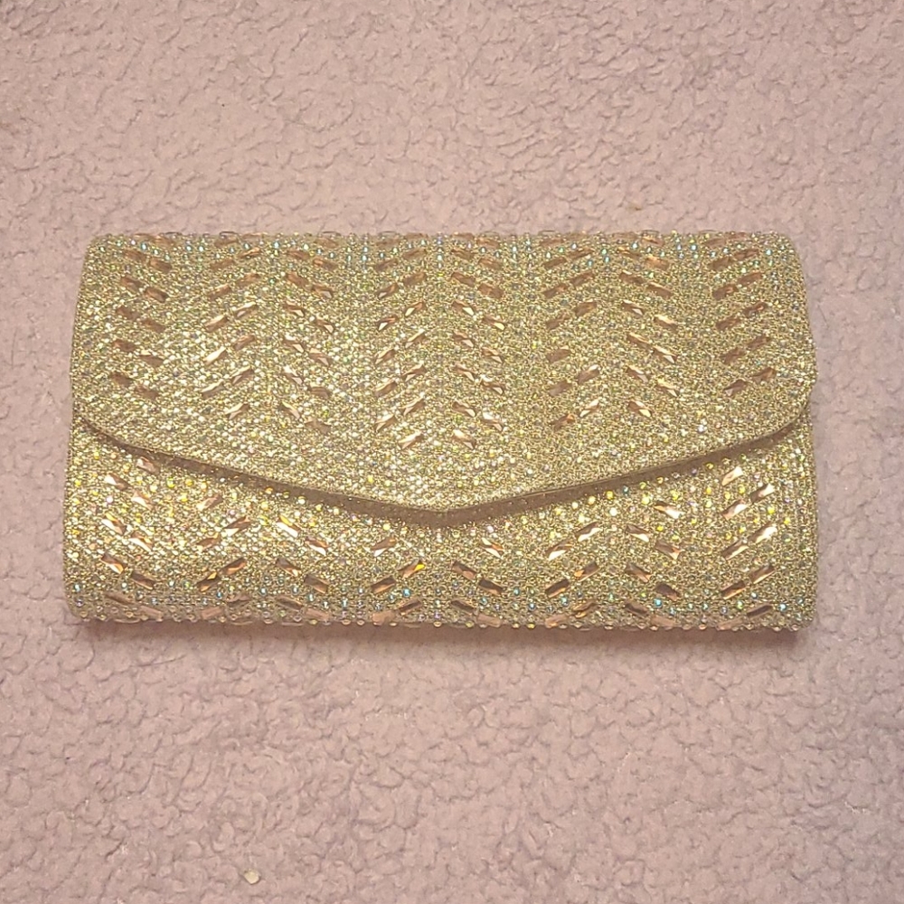 Womens gold clutch with rhinestone design
